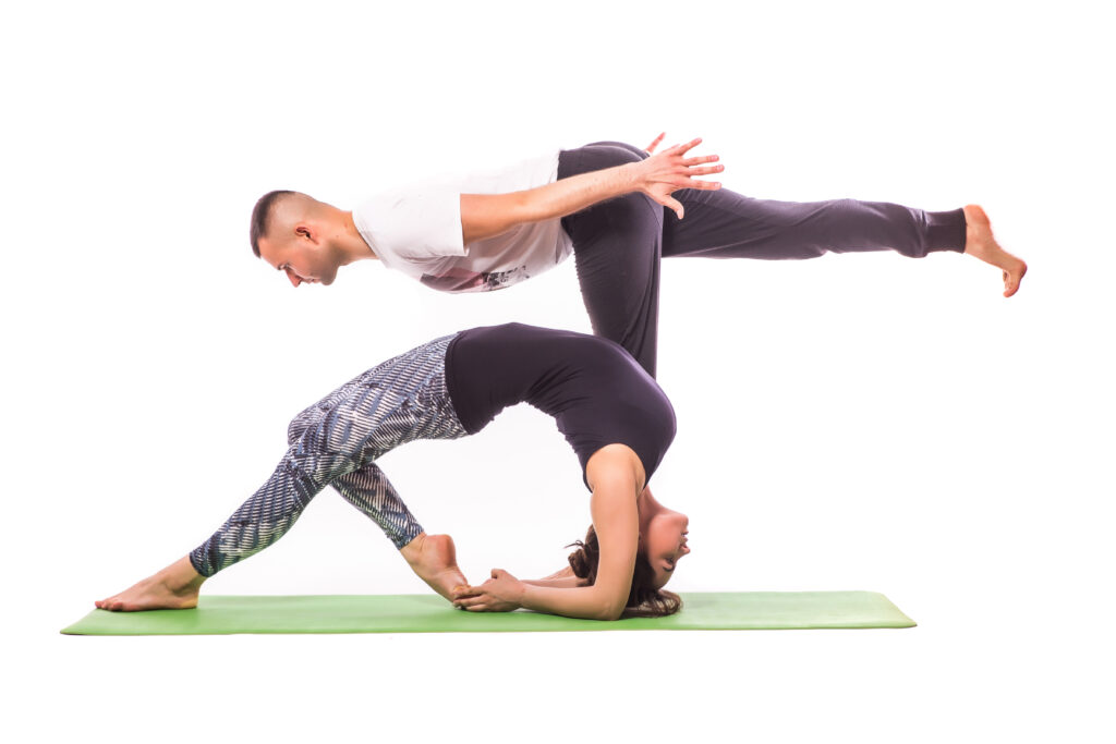 couple practicing acro yoga white studio acro yoga concept pair yoga yoga flexibility class workout