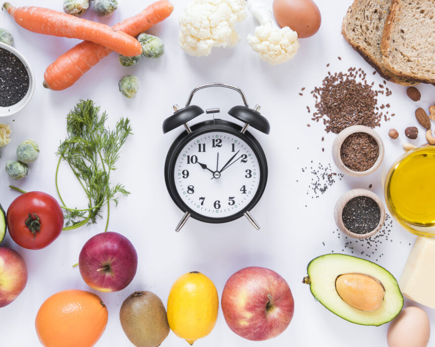 variety ingredients with alarm clock arranged against isolated white background scaled 1
